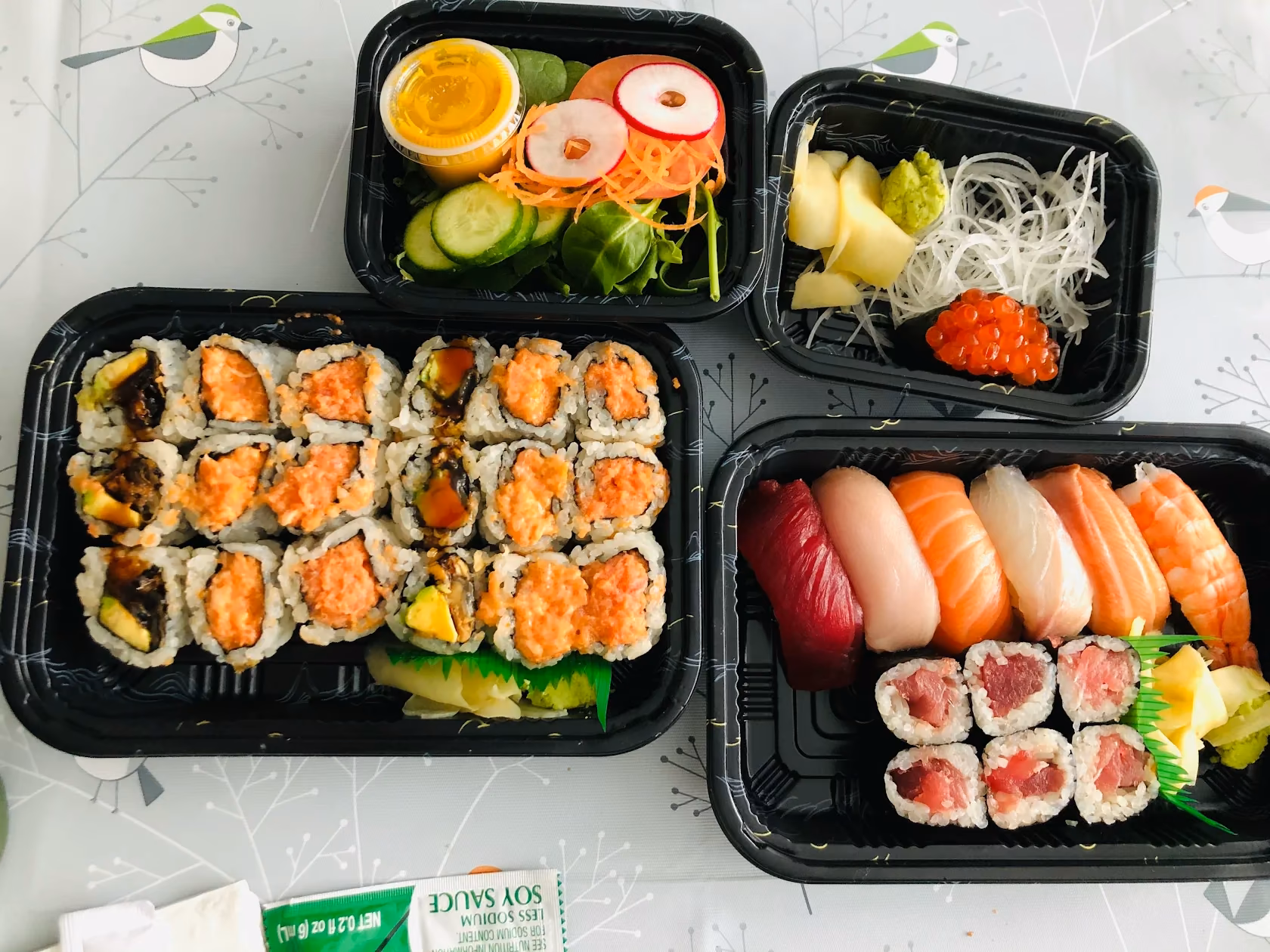 Takeaway trays of rolls, nigiri and sides