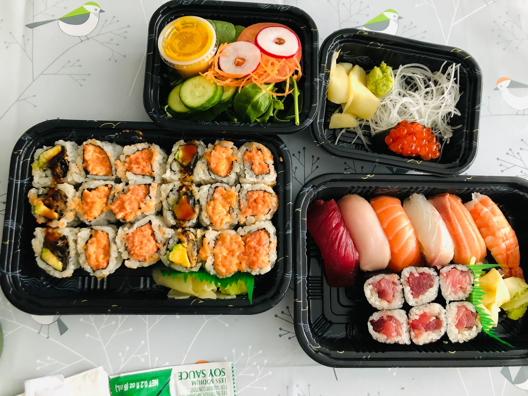 Takeaway trays of rolls, nigiri and sides